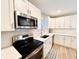 Modern kitchen featuring stainless steel appliances and white shaker cabinets at 3305 S New Jersey St, Indianapolis, IN 46227