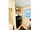 Laundry room with washer, dryer, and built-in shelving at 3305 S New Jersey St, Indianapolis, IN 46227