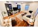 Living room with hardwood floors, sectional sofa, and built-in shelving at 3305 S New Jersey St, Indianapolis, IN 46227