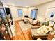Open living area with hardwood floors, sectional sofa, and built-in shelving at 3305 S New Jersey St, Indianapolis, IN 46227