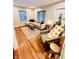 Cozy living room featuring hardwood floors, sectional sofa, and accent chair at 3305 S New Jersey St, Indianapolis, IN 46227