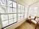 Bright sunroom with ample windows and view of backyard at 3305 S New Jersey St, Indianapolis, IN 46227