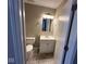 Clean bathroom with vanity, toilet and neutral tile flooring at 3371 Lauren Dr, Indianapolis, IN 46235