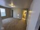 Bright bedroom featuring carpet, neutral walls, and access to bathroom at 3371 Lauren Dr, Indianapolis, IN 46235