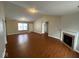 Open living area featuring hardwood floors and a fireplace at 3371 Lauren Dr, Indianapolis, IN 46235