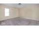 Neutral bedroom with window letting in natural light and carpeted floors at 3614 E New York St, Indianapolis, IN 46201