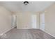 Spacious bedroom with carpeted floor, neutral walls, and multiple doors at 3614 E New York St, Indianapolis, IN 46201
