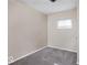 Small bedroom with a window, carpeted floor, and neutral walls at 3614 E New York St, Indianapolis, IN 46201