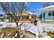 Street view of a tan bungalow with a brick front porch at 3614 E New York St, Indianapolis, IN 46201