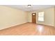 Empty living room with laminate wood flooring at 3614 E New York St, Indianapolis, IN 46201