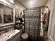 Bathroom with tub, shower, and white vanity at 4651 Maplelawn Dr, Columbus, IN 47203