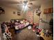 Second bedroom with a bed and colorful decor at 4651 Maplelawn Dr, Columbus, IN 47203