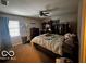 Main bedroom with a large bed and ample closet space at 4651 Maplelawn Dr, Columbus, IN 47203