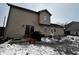 Tan two-story house exterior with small patio at 4651 Maplelawn Dr, Columbus, IN 47203