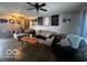 Spacious living room with beige couch and hardwood floors at 4651 Maplelawn Dr, Columbus, IN 47203