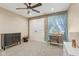 Charming bedroom with rustic wood accent wall and ceiling fan at 5152 Coppertree Ln, Avon, IN 46123