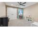 Spacious bedroom with ceiling fan, wood accent wall, and ample closet space at 5152 Coppertree Ln, Avon, IN 46123