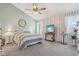 Primary bedroom with vaulted ceilings, ceiling fan, and striped bedding at 5152 Coppertree Ln, Avon, IN 46123
