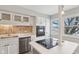 Modern kitchen with white cabinets, stainless steel appliances and an island at 5152 Coppertree Ln, Avon, IN 46123
