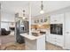 Modern kitchen with white cabinets, stainless steel appliances and an island at 5152 Coppertree Ln, Avon, IN 46123