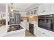 Modern kitchen with white cabinets, stainless steel appliances and an island at 5152 Coppertree Ln, Avon, IN 46123