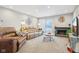 Spacious living room with leather couches and a fireplace at 5152 Coppertree Ln, Avon, IN 46123