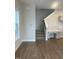 Entryway view with hardwood floors, stairs to the second floor, and built-in desk area at 525 Gilder Dr, Carmel, IN 46032