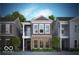 Two-story home with brick and siding exterior, balcony, and landscaping at 525 Gilder Dr, Carmel, IN 46032