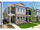 New construction townhome with brick and siding, manicured lawn, and sidewalk at 525 Gilder Dr, Carmel, IN 46032