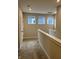 Upstairs hallway featuring carpeting, three windows, white trim, and neutral wall color at 525 Gilder Dr, Carmel, IN 46032