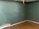 Spacious bedroom with hardwood floors and ceiling fan at 5420 Skyridge Dr, Indianapolis, IN 46250