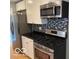 Modern kitchen features stainless steel appliances and granite countertops at 5420 Skyridge Dr, Indianapolis, IN 46250