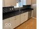 Kitchen boasts modern appliances and dark granite countertops at 5420 Skyridge Dr, Indianapolis, IN 46250