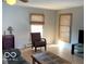 Bright living room with tiled floors and large windows at 5420 Skyridge Dr, Indianapolis, IN 46250