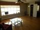 Living room with hardwood floors, large window, and ceiling fan at 5420 Skyridge Dr, Indianapolis, IN 46250