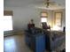 Living room with tile floor, ceiling fan, and gray sofa at 5420 Skyridge Dr, Indianapolis, IN 46250