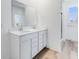 Modern bathroom with double vanity, a large mirror, and a walk-in shower at 5751 Cr W 750 N, McCordsville, IN 46055