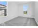 Spacious bedroom with gray carpeting and window views at 5751 Cr W 750 N, McCordsville, IN 46055