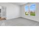 Spacious bedroom with gray carpet, a walk-in closet, and window views at 5751 Cr W 750 N, McCordsville, IN 46055