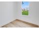 Bright bedroom with hardwood floors and a large window overlooking a grassy yard at 5751 Cr W 750 N, McCordsville, IN 46055