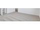 Grey carpeted bedroom with an open door to the hallway at 5751 Cr W 750 N, McCordsville, IN 46055