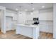 Modern white kitchen with center island and stainless steel appliances at 5751 Cr W 750 N, McCordsville, IN 46055