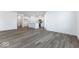 Open living room and kitchen with hardwood floors at 5751 Cr W 750 N, McCordsville, IN 46055