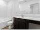 Clean bathroom with dark vanity and a white bathtub at 5755 Cr W 750 N, McCordsville, IN 46055