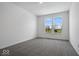 Bright bedroom with grey carpet and a view at 5755 Cr W 750 N, McCordsville, IN 46055