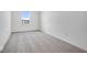 Bright bedroom with grey carpet and a window at 5755 Cr W 750 N, McCordsville, IN 46055