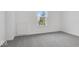Bright bedroom with grey carpet and a window at 5755 Cr W 750 N, McCordsville, IN 46055