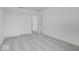 Grey carpeted bedroom with access to a hallway at 5755 Cr W 750 N, McCordsville, IN 46055