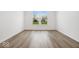 Well-lit bedroom featuring hardwood floors and a window at 5755 Cr W 750 N, McCordsville, IN 46055