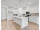 Modern kitchen with white cabinets, quartz countertops, and stainless steel appliances at 5755 Cr W 750 N, McCordsville, IN 46055